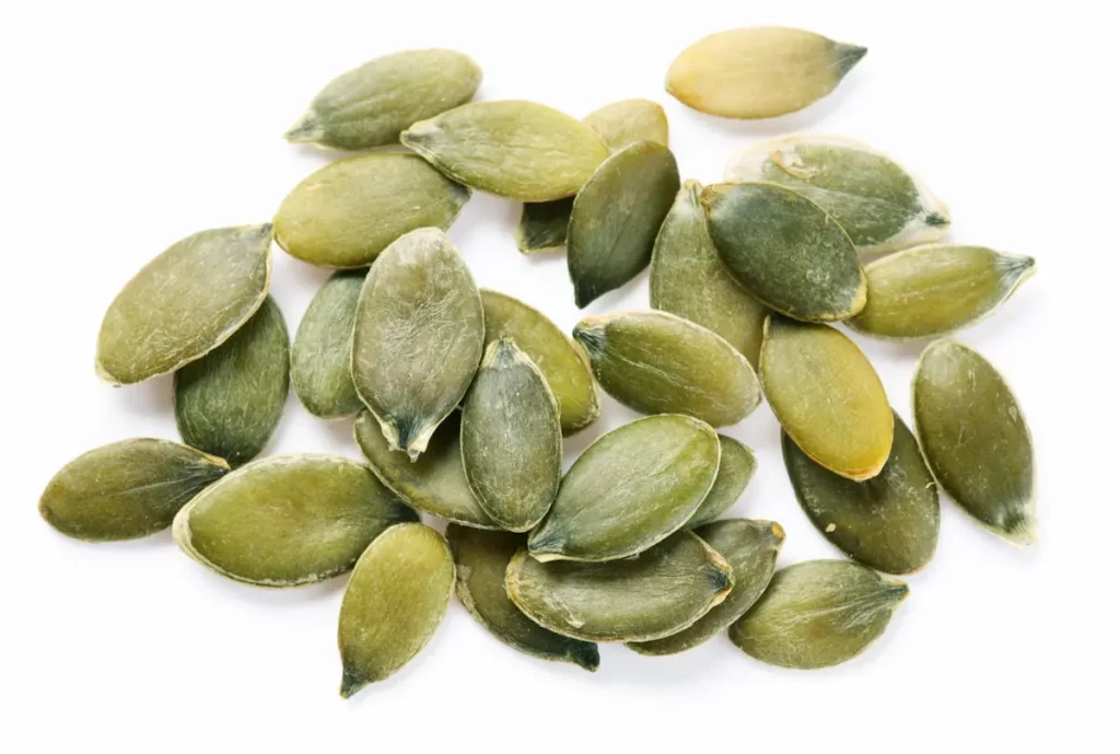 Close up on raw pumpkin seeds which are healthy for dogs