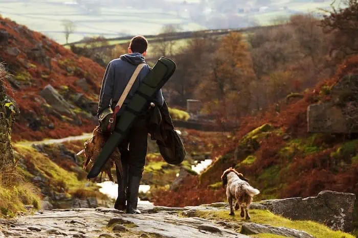 Owner and his dog catching a deer